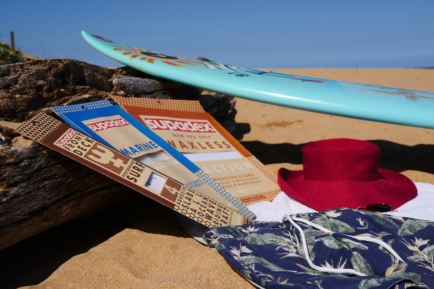 Supadex surfboard grips with surfboard on the beach at Avoca Beach, north of Sydney, Australia.